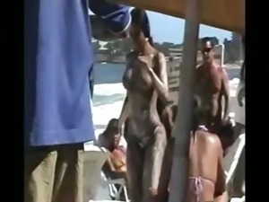 Several hottie chicks caught on camera half-naked  on a beach in Brazil