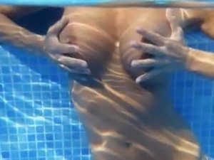 Underwater strip of beautiful nipples