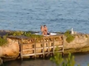 Pussy licking and coitus by the sea